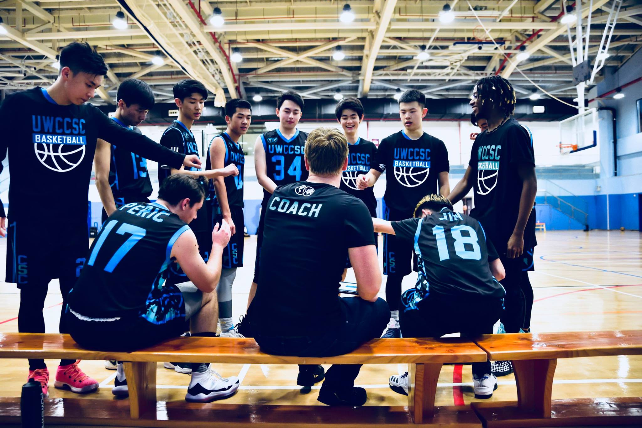 Jessiah coaching players during a basketball session