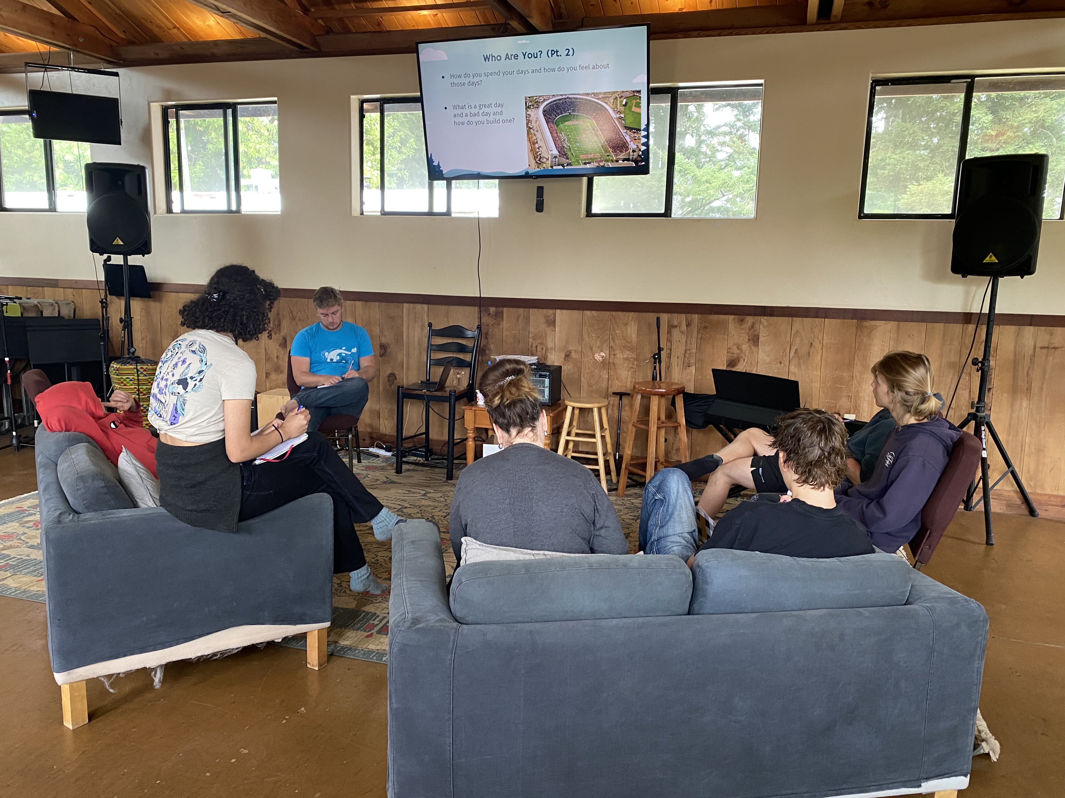 Camp group gathered in interior meeting space