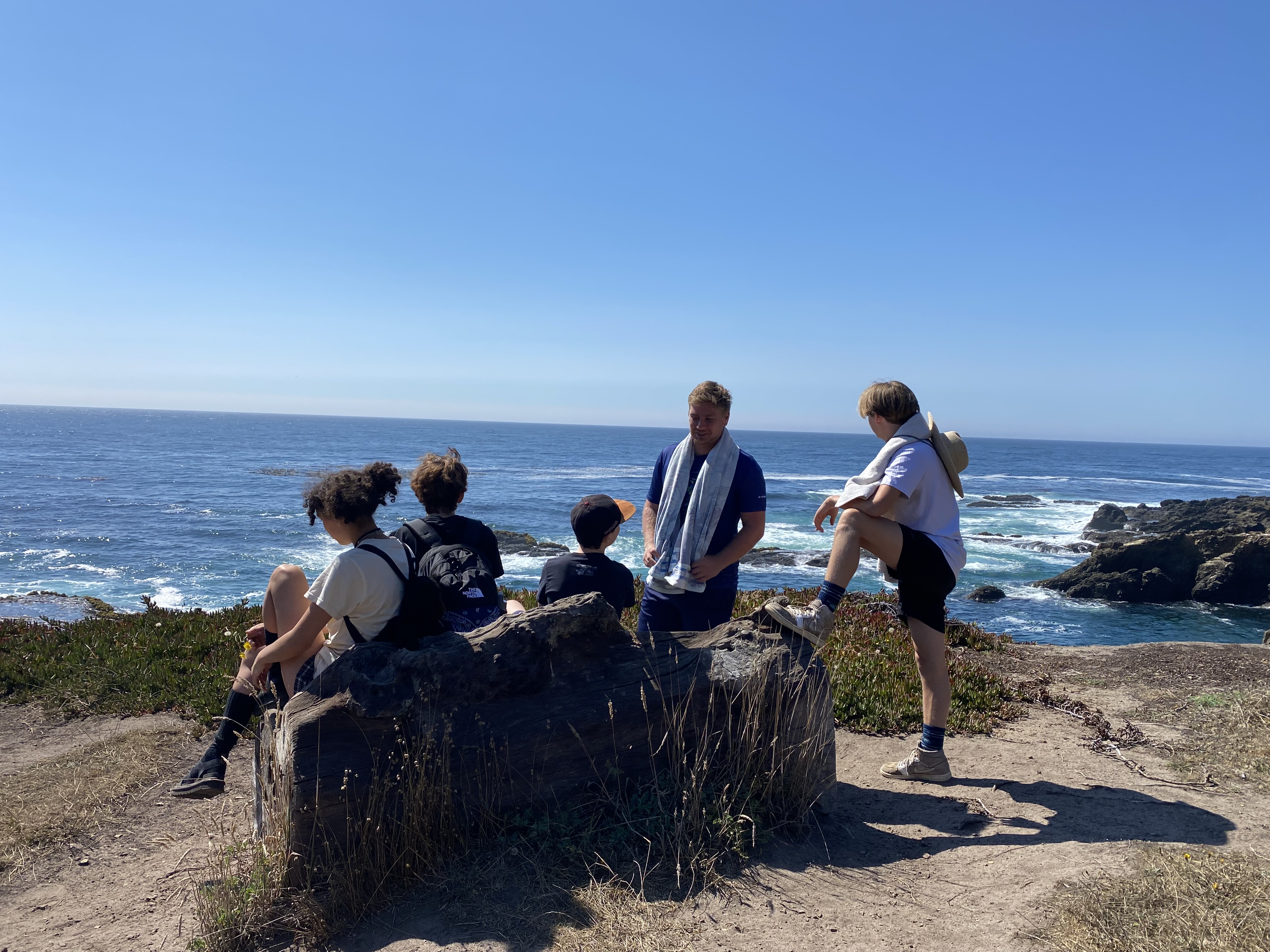 Campers looking out at the coast